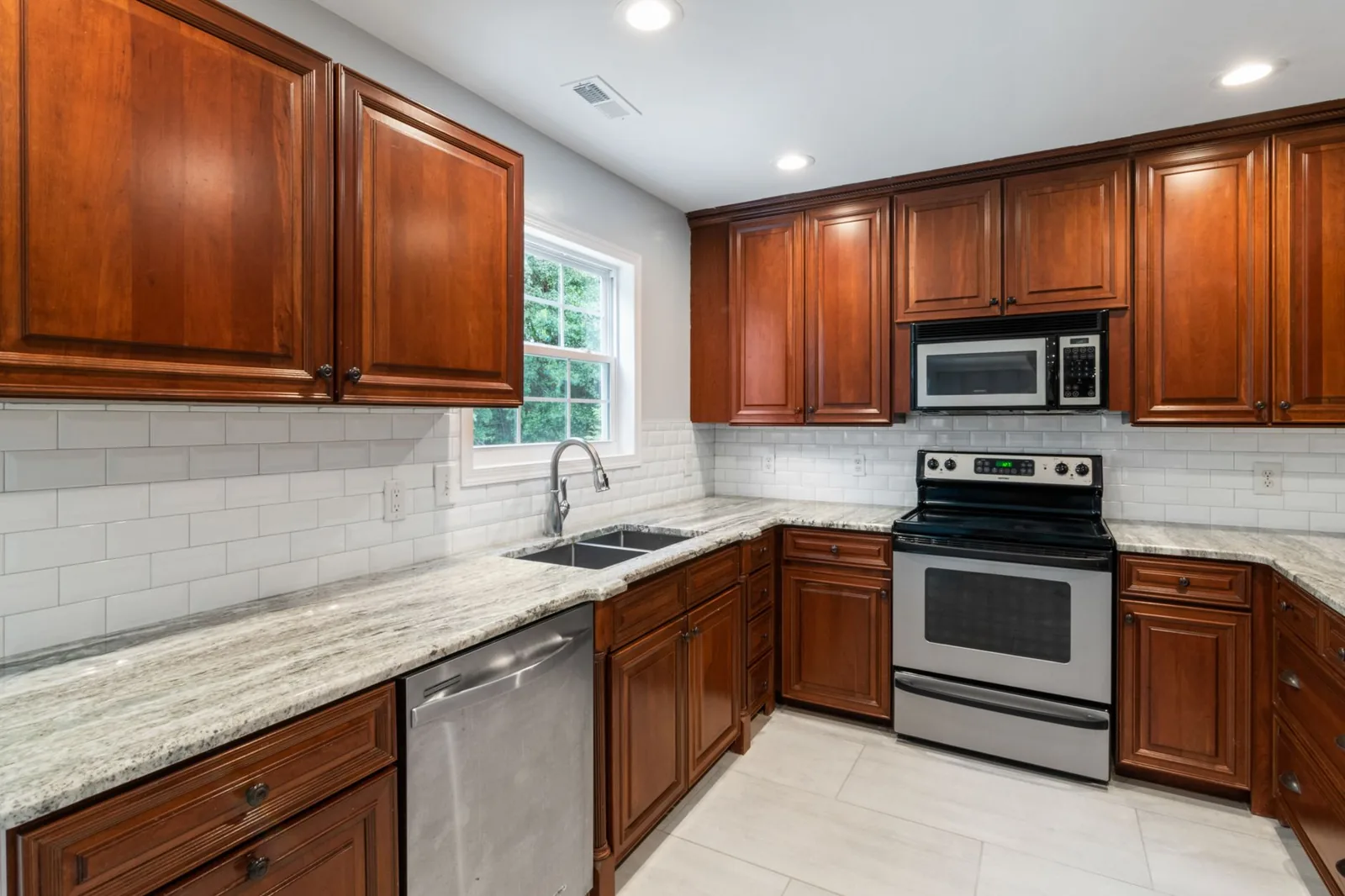 Kitchen remodel vs renovation comparison of a refreshed and a fully rebuilt kitchen