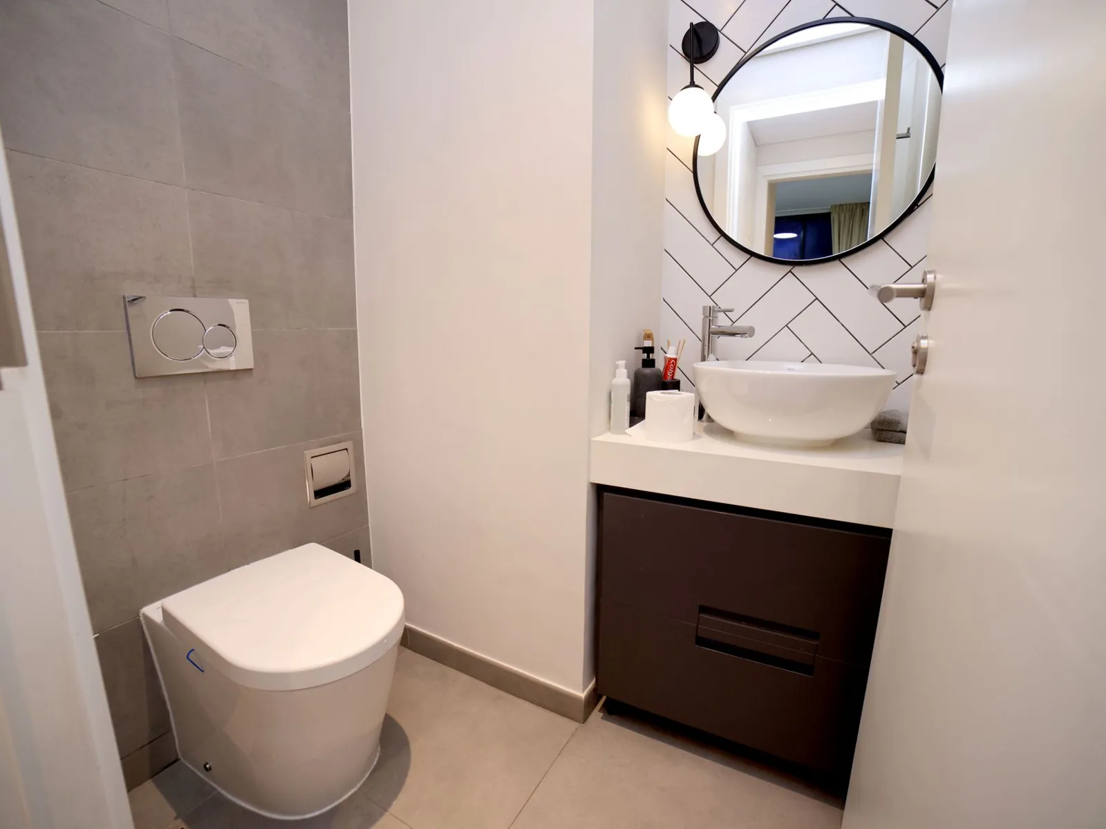 bathroom remodel ideas for small bathrooms — floating vanity and vertical storage
