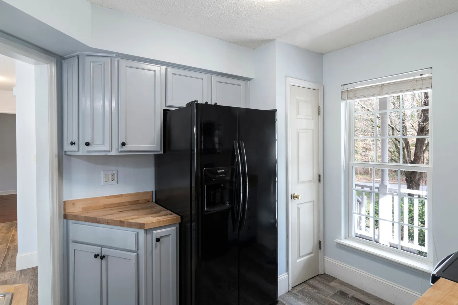 Butcher block countertop vs quartz shown side by side in a modern kitchen