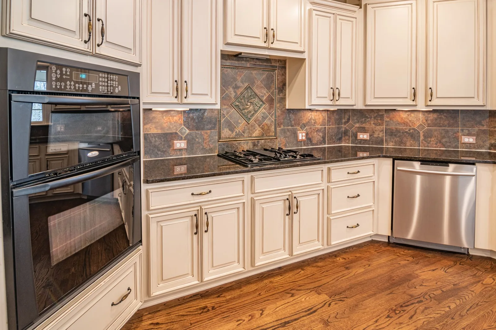Newly refinished kitchen cabinets after a refacing project