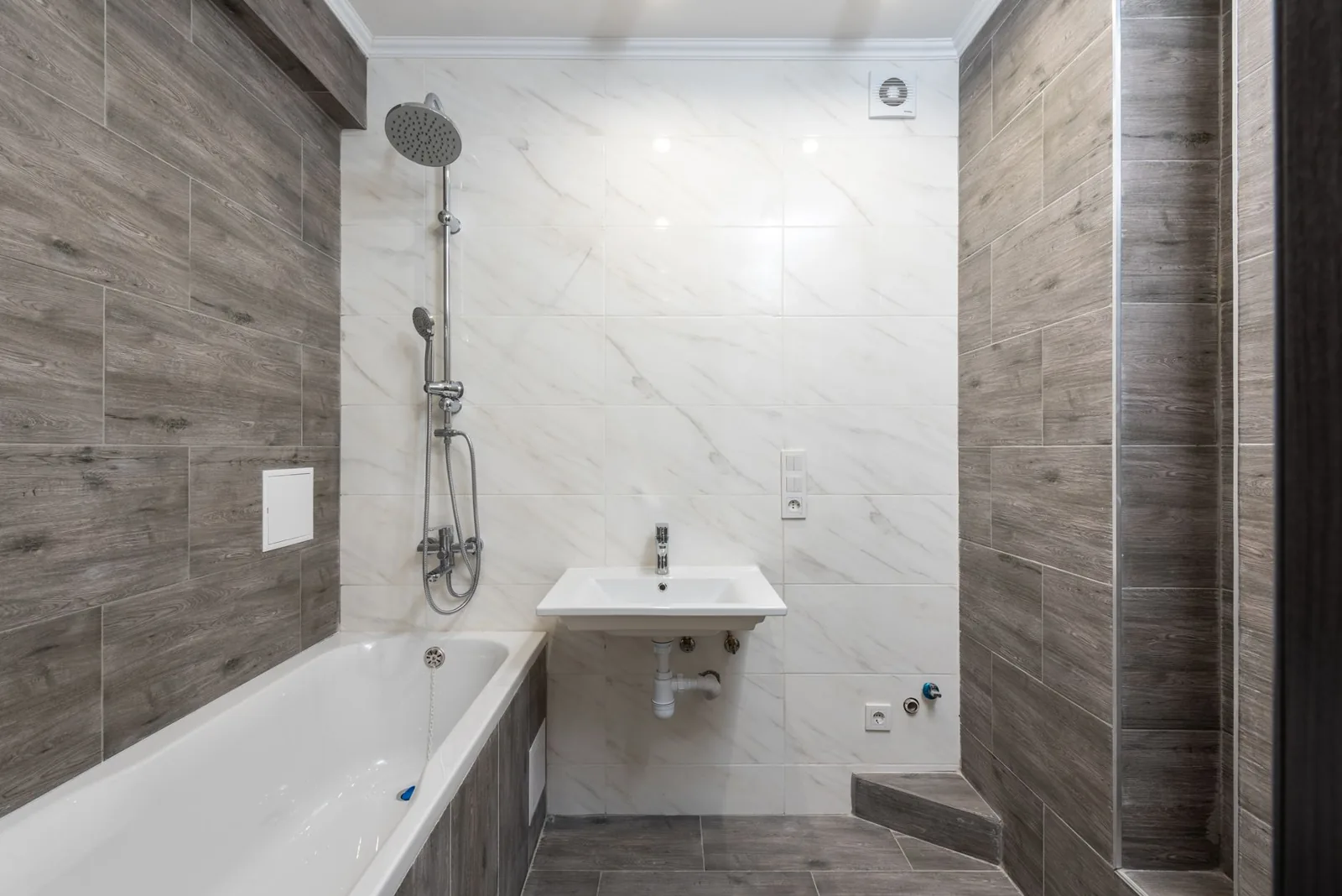 Refreshed grout, new hardware, and updated lighting can all be done on a budget