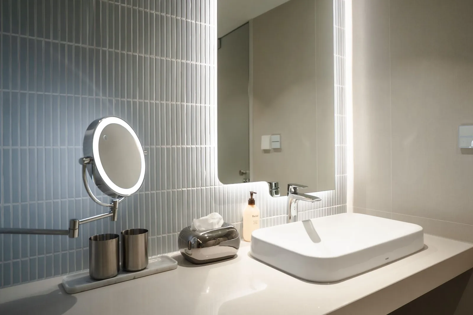 Tiled walk-in shower with frameless glass door