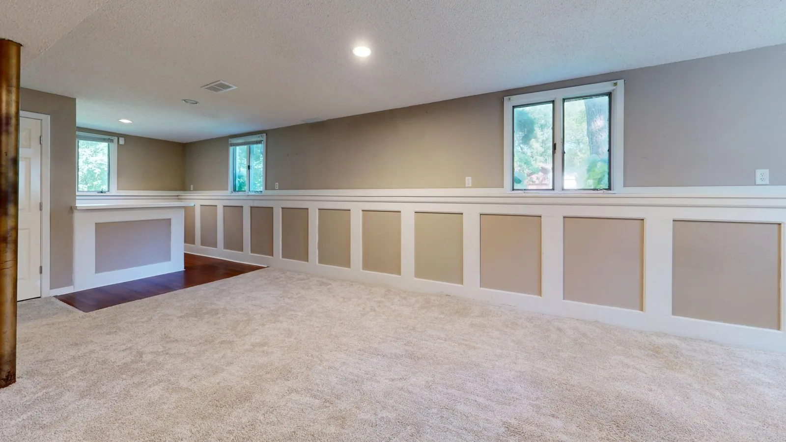 finished basement interior with luxury vinyl plank flooring