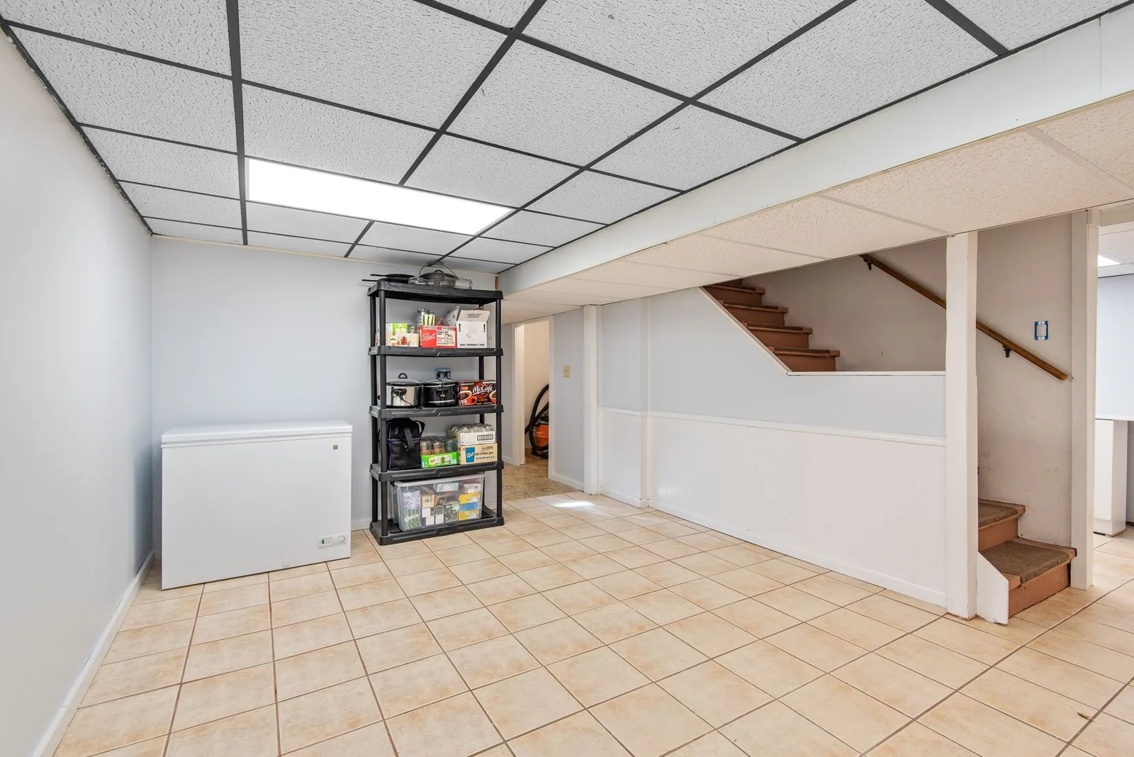 Applying interior basement waterproofing coating along a foundation wall