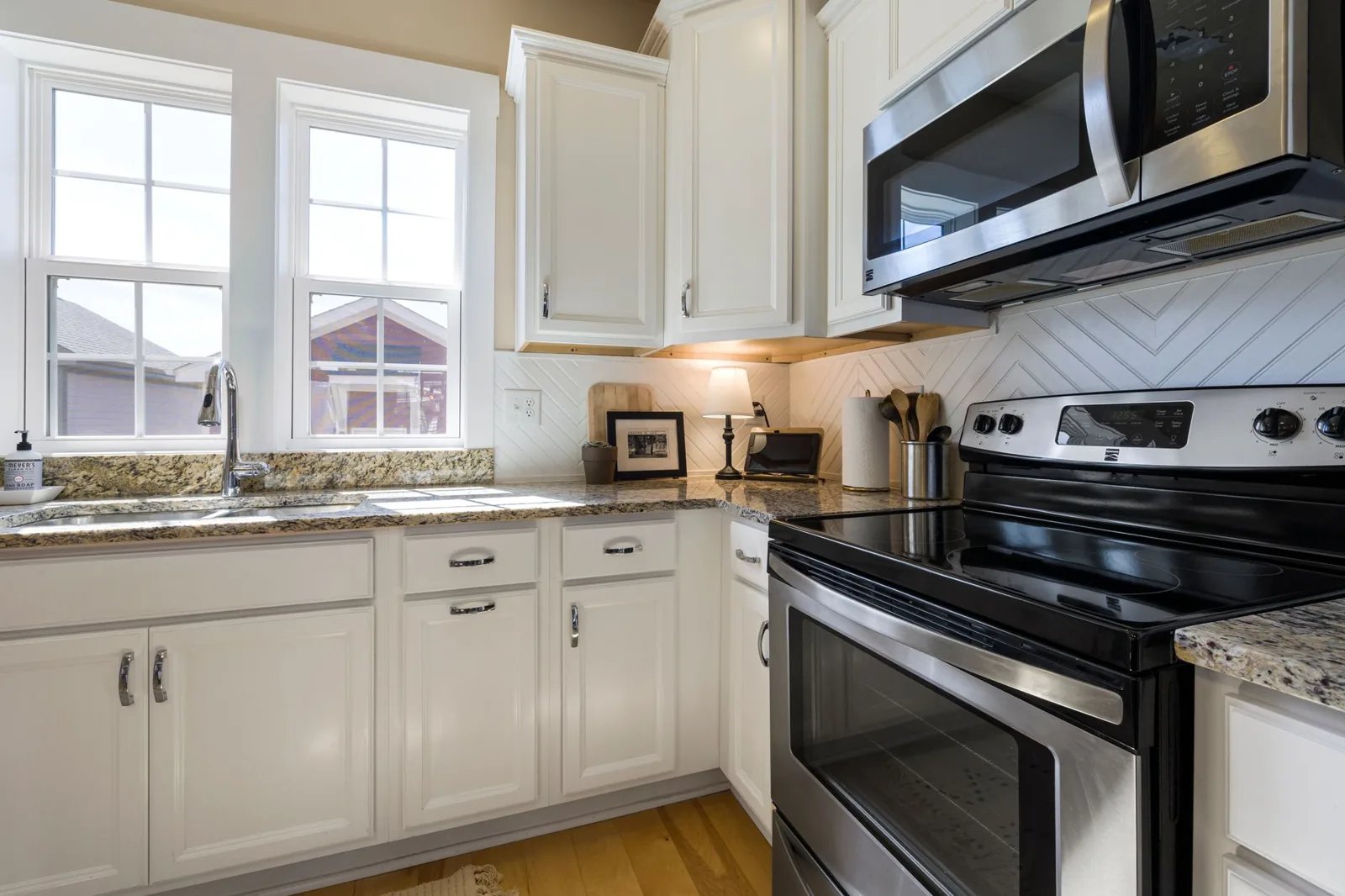 New shaker-style doors installed over existing cabinet boxes