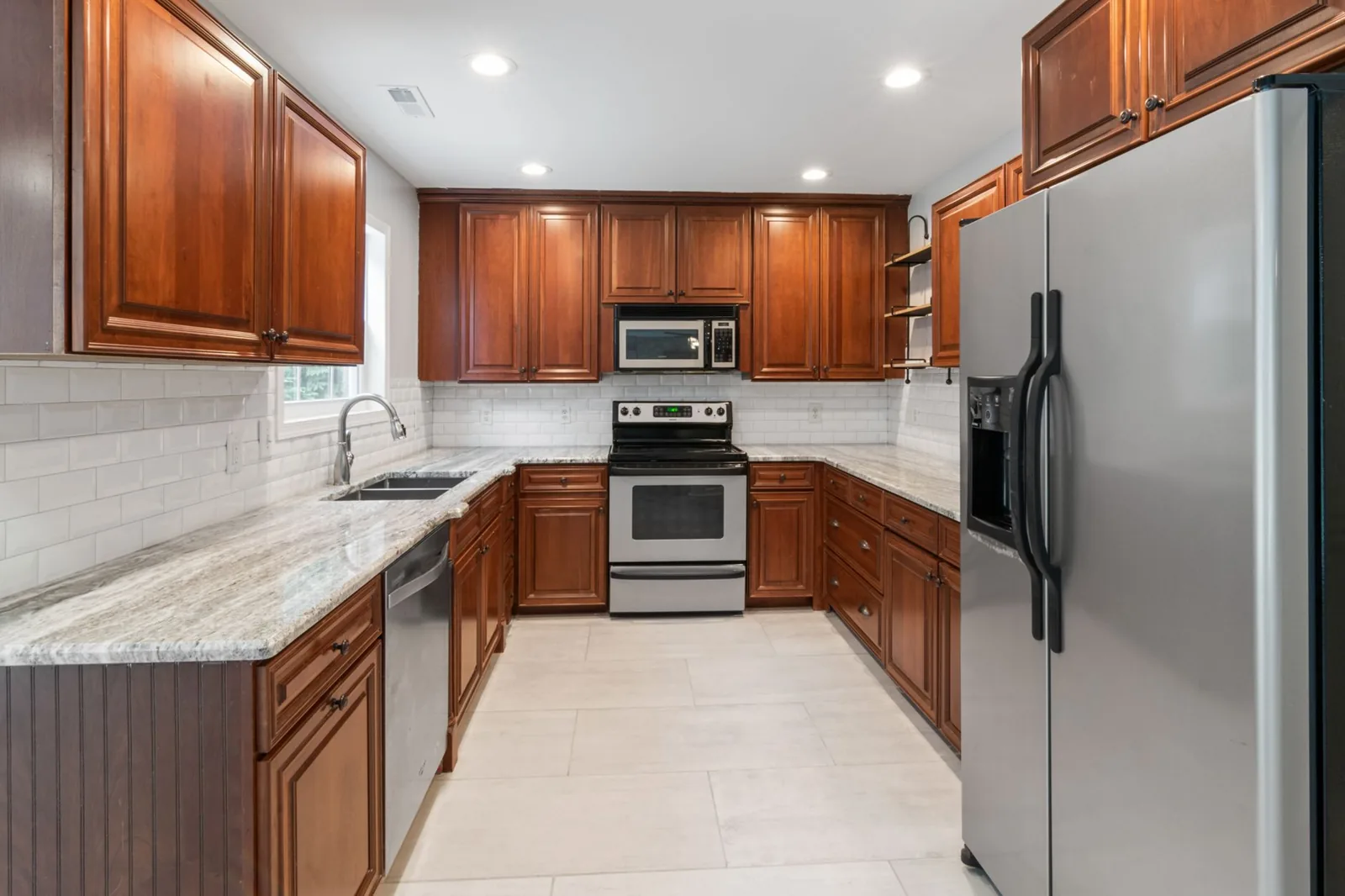 Kitchen remodel with custom cabinetry and quartz countertops